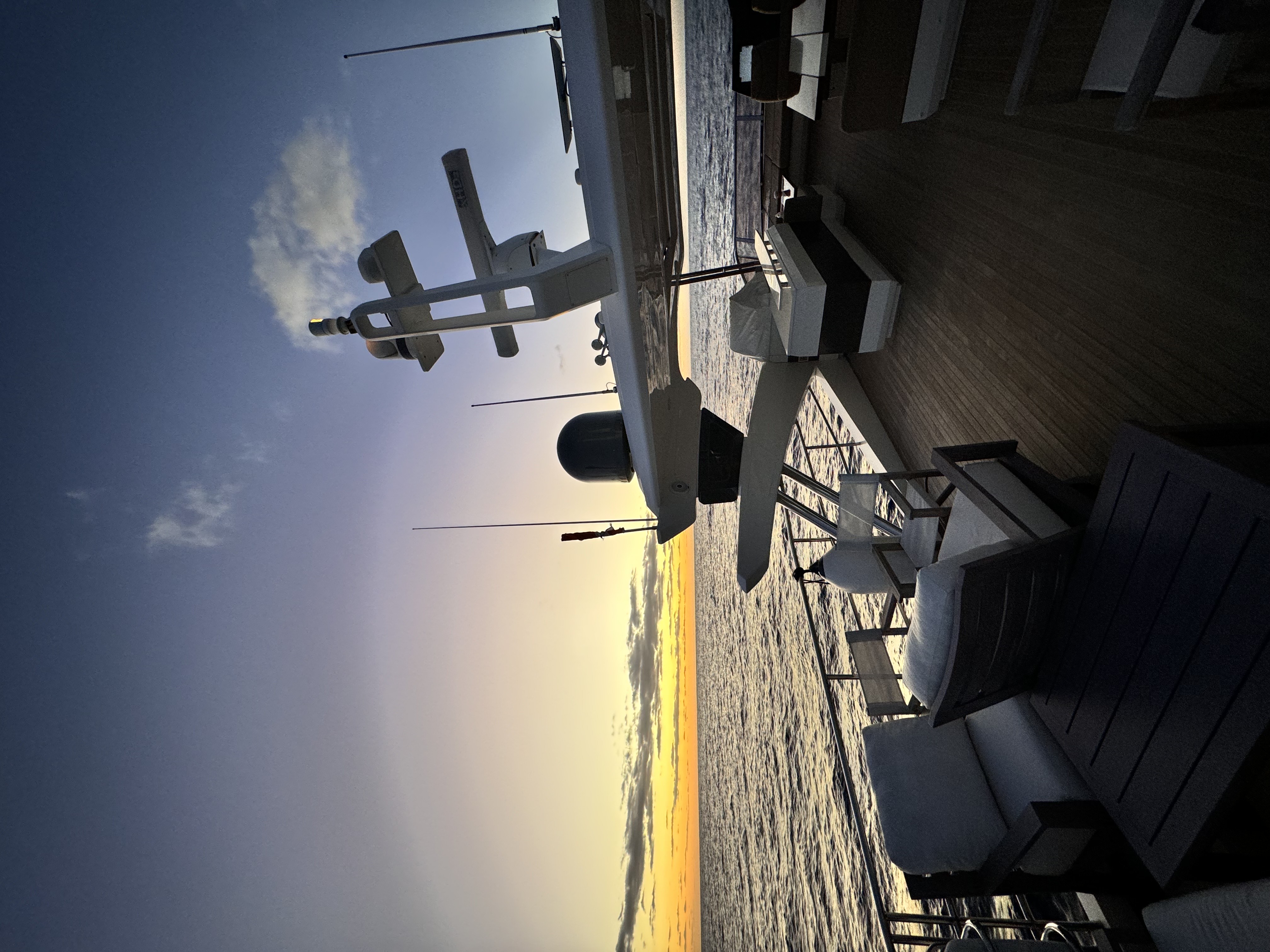 A yacht deck at sunset.